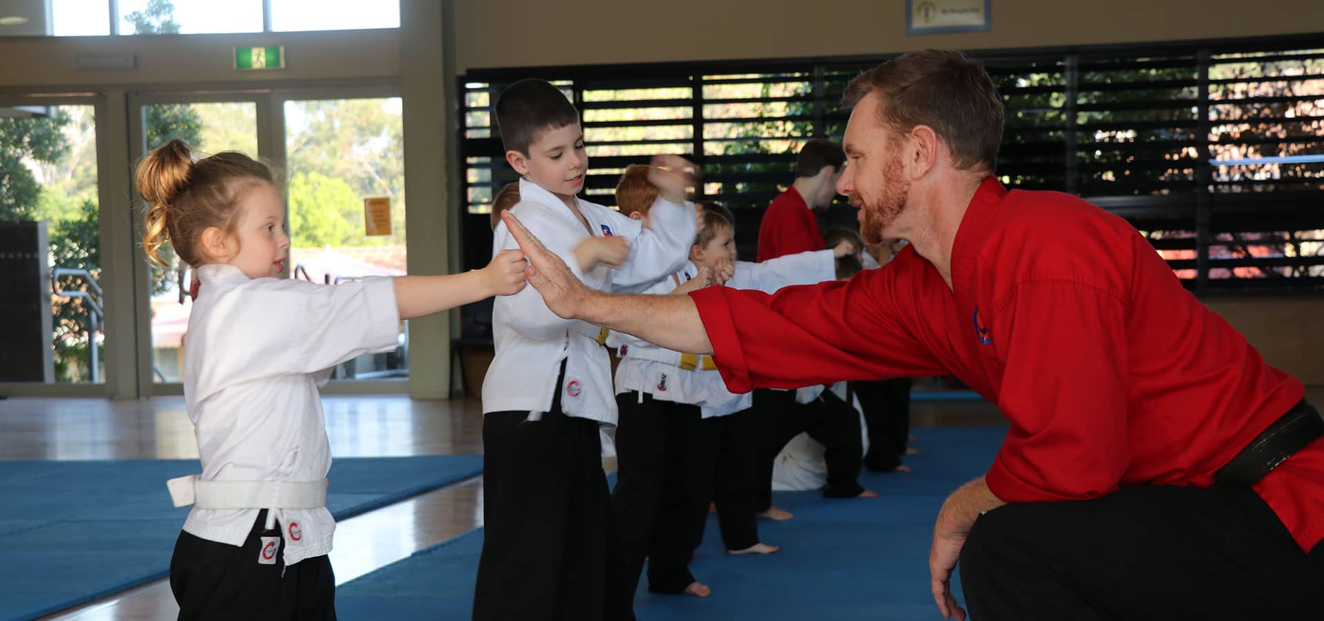 Children practising focus during a Southern Cross Martial Arts class on the Gold Coast